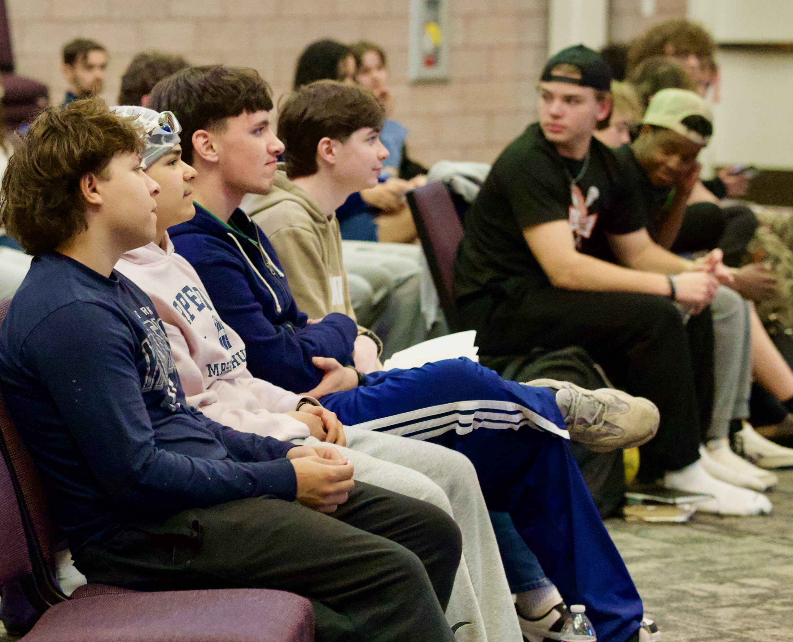 Students listening during teaching at Revolution Youth
